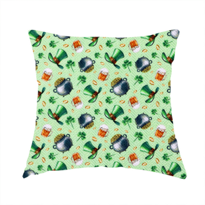The fabric used to create these handmade cushions is a high-detail St. Patrick's Day fabric pattern on a light green textured background. The print features iron cauldrons overflowing with gold coins, frothy beer mugs, green leprechaun top hats with gold buckles, and scattered four-leaf clovers.