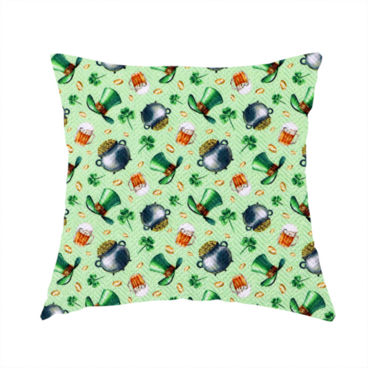 The fabric used to create these handmade cushions is a high-detail St. Patrick's Day fabric pattern on a light green textured background. The print features iron cauldrons overflowing with gold coins, frothy beer mugs, green leprechaun top hats with gold buckles, and scattered four-leaf clovers.