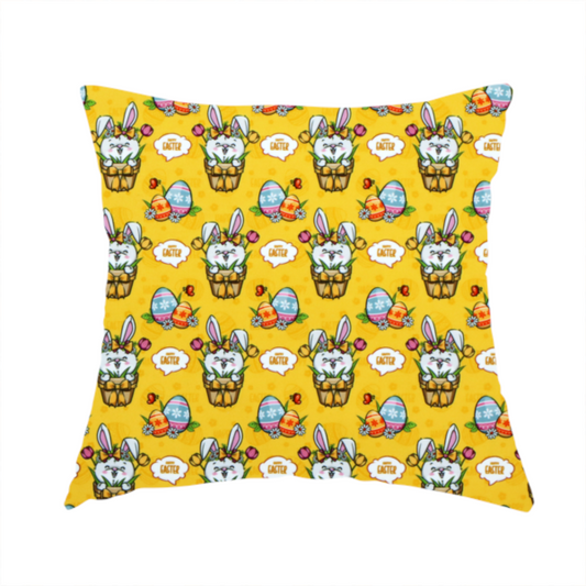 The fabric used to create these handmade cushions is a is a vibrant, repetitive Easter-themed pattern fabric, set against a bright mustard-yellow background. The design features several recurring hand-drawn, cartoon-style illustrations.