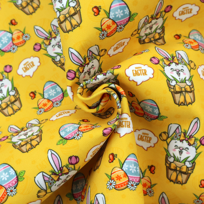 This is a vibrant, repetitive Easter-themed pattern fabric, set against a bright mustard-yellow background. The design features several recurring hand-drawn, cartoon-style illustrations.