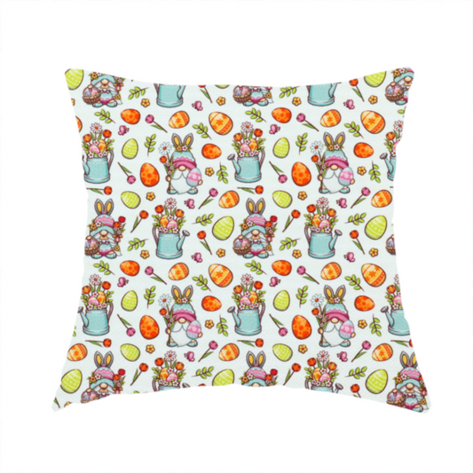 The fabric used to create these handmade cushions is a features a playful and detailed Easter garden pattern set against a crisp, white background. The design is a bright and busy "tossed" print that combines the popular gnome trend with traditional spring motifs.