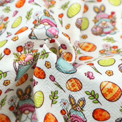 This fabric features a playful and detailed Easter garden pattern set against a crisp, white background. The design is a bright and busy "tossed" print that combines the popular gnome trend with traditional spring motifs.