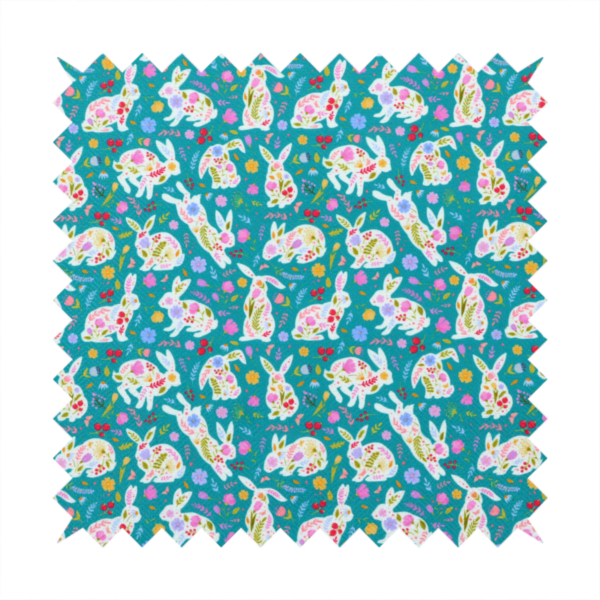 This fabric features a vibrant, folk-art inspired Easter pattern set against a rich teal-green background. The design is characterized by its high-contrast colour palette and intricate floral silhouettes.