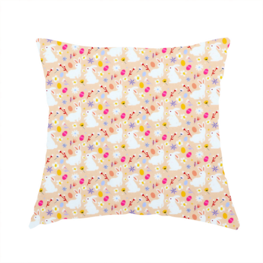 The fabric used to create these handmade cushions features a delicate, dainty Easter meadow pattern on a soft, peachy-beige background. The design is airy and feminine, characterized by small-scale illustrations and a palette of pastel and vibrant spring colours.
