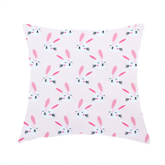 The fabric used to create these handmade cushions features a modern, minimalist bunny pattern set against a soft, pale pink background. The design is clean and contemporary, focusing on a repeating motif of stylized rabbit faces.