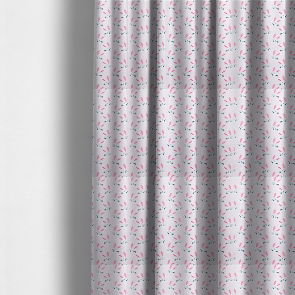 The fabric used to create these made-to-measure curtains features a modern, minimalist bunny pattern set against a soft, pale pink background. The design is clean and contemporary, focusing on a repeating motif of stylized rabbit faces.