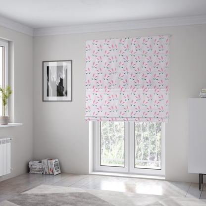 The fabric used to create these Roman blinds features a modern, minimalist bunny pattern set against a soft, pale pink background. The design is clean and contemporary, focusing on a repeating motif of stylized rabbit faces.
