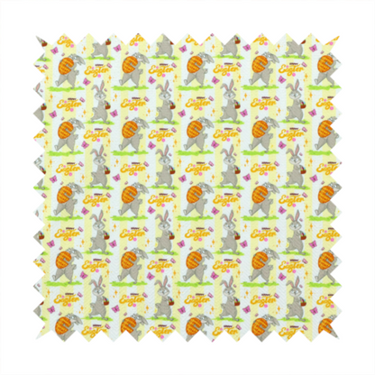 This fabric features a cheery and active Easter bunny pattern set against a vertical striped background of pale yellow and white. The design has a classic animated feel, full of personality and holiday spirit.