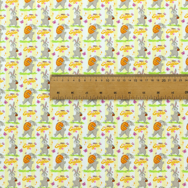 This fabric features a cheery and active Easter bunny pattern set against a vertical striped background of pale yellow and white. The design has a classic animated feel, full of personality and holiday spirit.