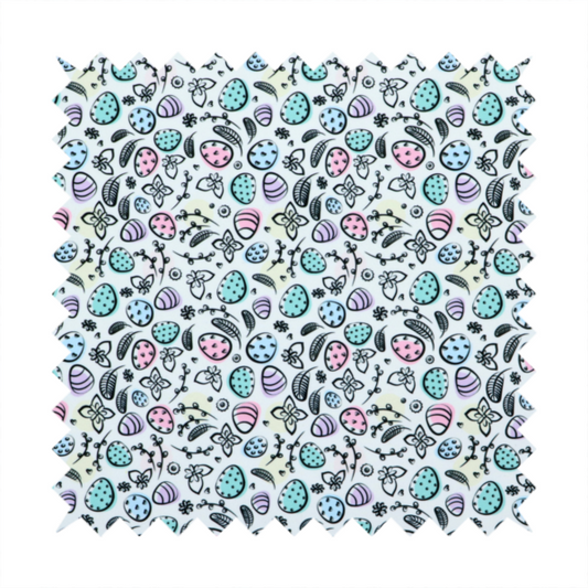 This fabric features an artistic, hand-illustrated Easter egg pattern on a cool, pale blue background. The design has a sketchbook or "doodle" quality, with expressive black ink outlines and soft watercolour-style colour accents.