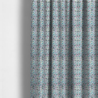 The fabric used to create these made-to-measure curtains features an artistic, hand-illustrated Easter egg pattern on a cool, pale blue background. The design has a sketchbook or "doodle" quality, with expressive black ink outlines and soft watercolour-style colour accents.