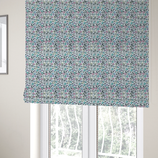The fabric used to create these Roman blinds features an artistic, hand-illustrated Easter egg pattern on a cool, pale blue background. The design has a sketchbook or "doodle" quality, with expressive black ink outlines and soft watercolour-style colour accents.