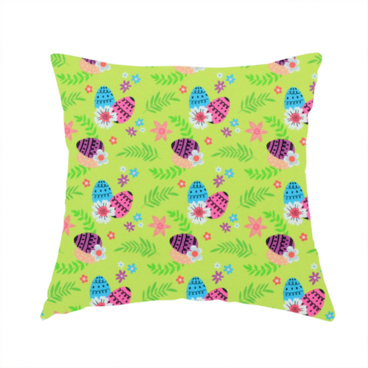 The fabric used to create these handmade cushions features a vibrant and modern Easter floral pattern set against a bright lime-green background. The design has a high-energy, "pop-art" feel with bold colours and playful, hand-drawn textures.