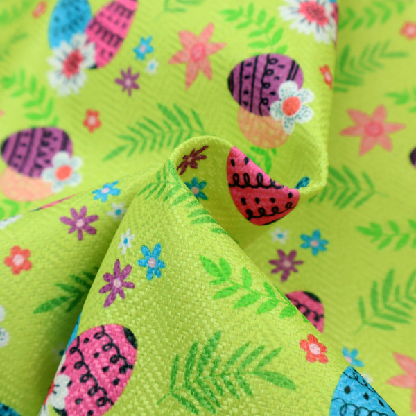 This fabric features a vibrant and modern Easter floral pattern set against a bright lime-green background. The design has a high-energy, "pop-art" feel with bold colours and playful, hand-drawn textures.