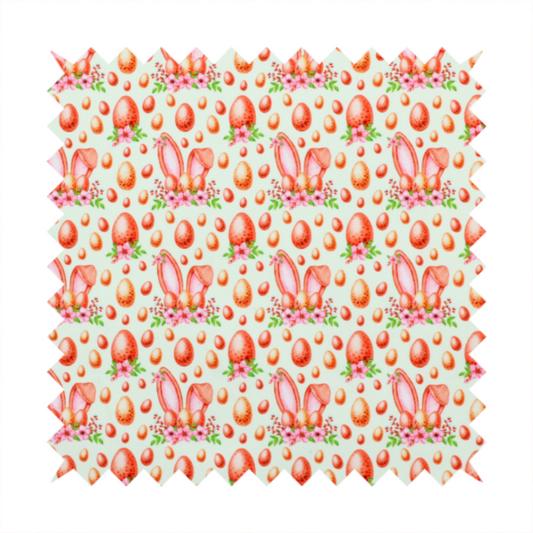 This fabric features a warm, watercolour-style Easter pattern on a very pale mint-green background. The design is rich in texture and soft tones, giving it a cosy and traditional holiday feel.