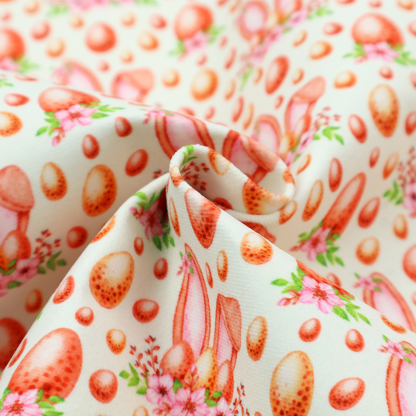 This fabric features a warm, watercolour-style Easter pattern on a very pale mint-green background. The design is rich in texture and soft tones, giving it a cosy and traditional holiday feel.