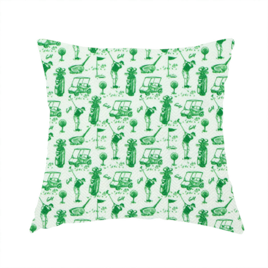 The fabric used to create these handmade cushions is a repeating novelty fabric pattern featuring green hand-sketched illustrations of golfers, golf bags, golf carts, and flags on a light cream-colored background.