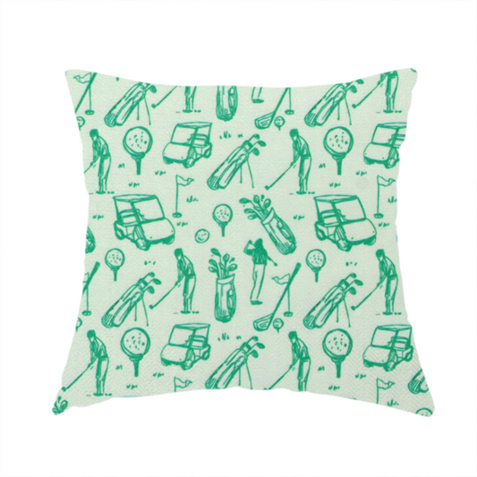 The fabric used to create these handmade cushions is a repeating fabric pattern featuring hand-sketched green illustrations of golf carts, golfers, golf bags, golf balls on tees, and flags on a light mint-green background.