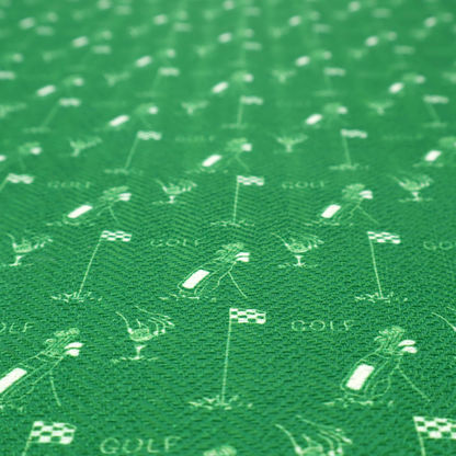 A repeating fabric pattern on a solid emerald green background, featuring small white icons of golf bags, checked flags, and the word 'GOLF' in a clean, sans-serif font.