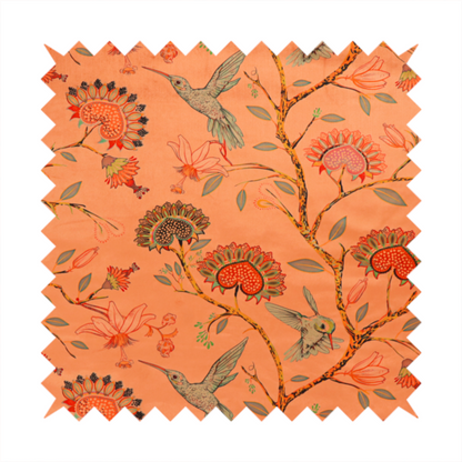 A vibrant botanical fabric pattern featuring detailed hummingbirds in flight among lush tropical flowers.