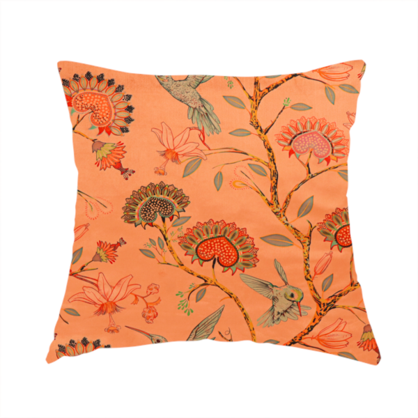 The fabric used to create this handmade cushion is a vibrant botanical fabric pattern featuring detailed hummingbirds in flight among lush tropical flowers.