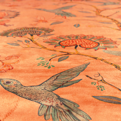 A vibrant botanical fabric pattern featuring detailed hummingbirds in flight among lush tropical flowers.