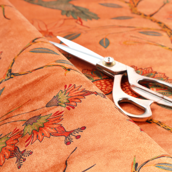 A vibrant botanical fabric pattern featuring detailed hummingbirds in flight among lush tropical flowers.