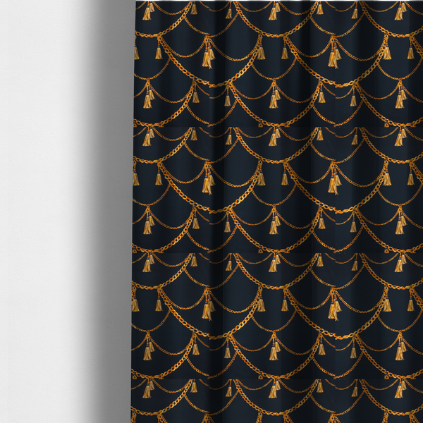 The fabric used to create these made-to-measure curtains is a luxury fashion-inspired fabric on a deep navy-black background. The design features elegant, draped golden chains arranged in a repeating scallop or 'swag' pattern, accented by highly detailed golden silk tassels suspended from ornate beaded cords.