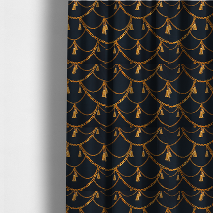 The fabric used to create these made-to-measure curtains is a luxury fashion-inspired fabric on a deep navy-black background. The design features elegant, draped golden chains arranged in a repeating scallop or 'swag' pattern, accented by highly detailed golden silk tassels suspended from ornate beaded cords.