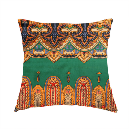 The fabric used to create these handmade cushions is an ornate jewel-toned border print fabric with a central green stripe flanked by intricate Persian-inspired teardrop and medallion motifs in amber and navy.