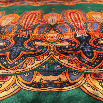 Ornate jewel-toned border print fabric with a central green stripe flanked by intricate Persian-inspired teardrop and medallion motifs in amber and navy.