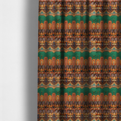 The fabric used to create these made-to-measure curtains is an ornate jewel-toned border print fabric with a central green stripe flanked by intricate Persian-inspired teardrop and medallion motifs in amber and navy.