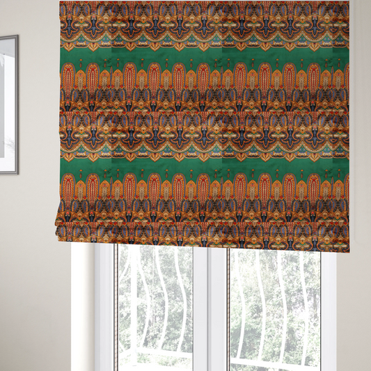 The fabric used to create these Roman blinds is an ornate jewel-toned border print fabric with a central green stripe flanked by intricate Persian-inspired teardrop and medallion motifs in amber and navy.