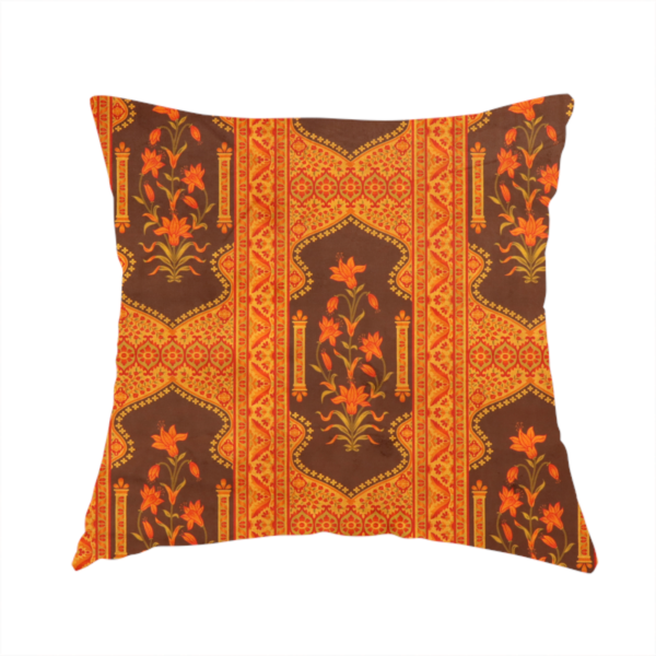 The fabric used to create this handmade cushion is a vertical stripe fabric featuring an intricate Mughal-inspired architectural pattern. The design displays orange lily bouquets enclosed within scalloped 'Palace Gate' arches, separated by decorative geometric borders in saffron, terracotta, and deep chocolate brown.