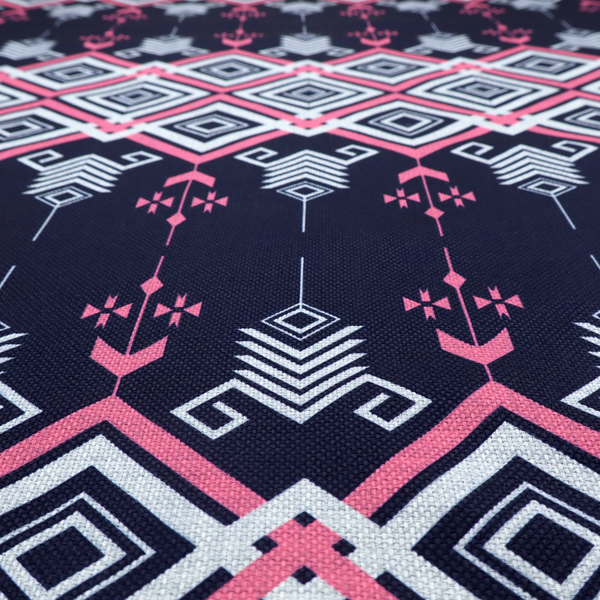 A sharp and sophisticated geometric fabric on a deep midnight navy background. The design features a prominent central horizontal band of interlocking diamonds in crisp white and neon pink, framed by intricate, vertical 'spear-like' motifs and delicate diamond accents that evoke a modern, high-contrast Ikat or tribal-inspired aesthetic.