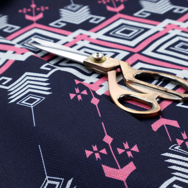 A sharp and sophisticated geometric fabric on a deep midnight navy background. The design features a prominent central horizontal band of interlocking diamonds in crisp white and neon pink, framed by intricate, vertical 'spear-like' motifs and delicate diamond accents that evoke a modern, high-contrast Ikat or tribal-inspired aesthetic.