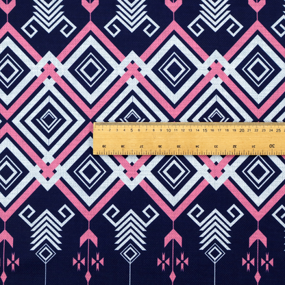 A sharp and sophisticated geometric fabric on a deep midnight navy background. The design features a prominent central horizontal band of interlocking diamonds in crisp white and neon pink, framed by intricate, vertical 'spear-like' motifs and delicate diamond accents that evoke a modern, high-contrast Ikat or tribal-inspired aesthetic.