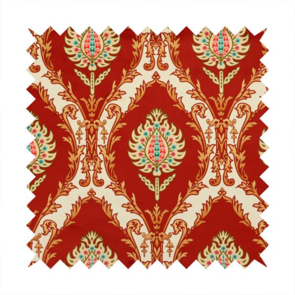 A grand, symmetrical damask-style fabric on a rich crimson red ground featuring ornate cream-colored leaf frames enclosing vibrant, stylized floral pinecones with teal and pink accents.