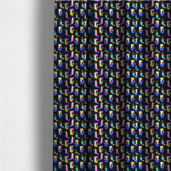 The fabric used to create these made-to-measure curtains is a  fun and vibrant children's fabric on a deep midnight-navy background. The pattern features a diverse cast of illustrated mermaids with various skin tones, hair colours (pink, blonde, brown), and colourful tails in shades of mint, yellow, pink, and purple, arranged in a cheerful repeating grid.