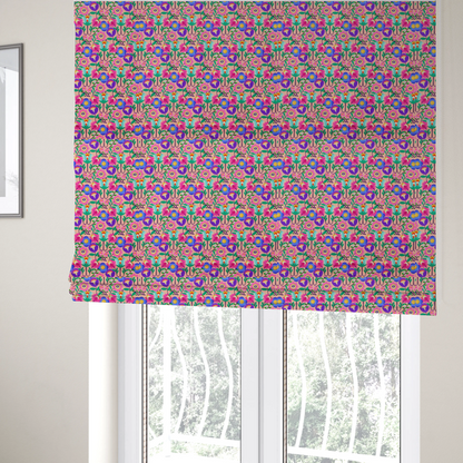 The fabric used to create these Roman blinds is a vibrant and energetic floral fabric on a soft peach-blush background. The design features a symmetrical folk-art arrangement of stylized flowers in neon pink, electric blue, violet, and turquoise, connected by emerald green leaves and delicate black stems in a dense, mirrored repeat.