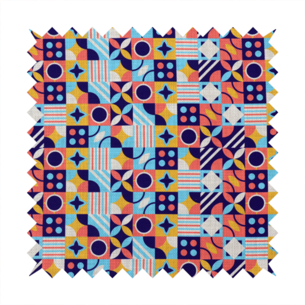 A high-energy, multi-coloured geometric fabric featuring a rhythmic grid of Bauhaus-inspired motifs. The design is a playful mosaic of circles, stars, stripes, and quarter-moons in a vibrant palette of mustard yellow, coral pink, sky blue, and deep midnight navy, all set against a textured, off-white linen-look background.