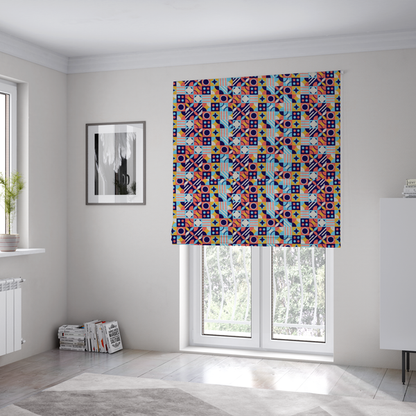 The fabric used to create these Roman blinds is a high-energy, multi-coloured geometric fabric featuring a rhythmic grid of Bauhaus-inspired motifs. The design is a playful mosaic of circles, stars, stripes, and quarter-moons in a vibrant palette of mustard yellow, coral pink, sky blue, and deep midnight navy, all set against a textured, off-white linen-look background.
