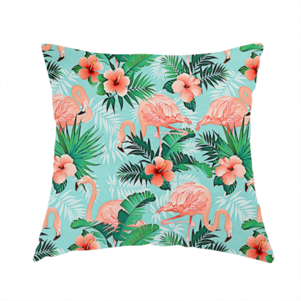 The fabric used to create these handmade cushions is a vibrant tropical pattern featuring pink flamingos, orange hibiscus flowers, and lush green palm leaves on a bright turquoise background.