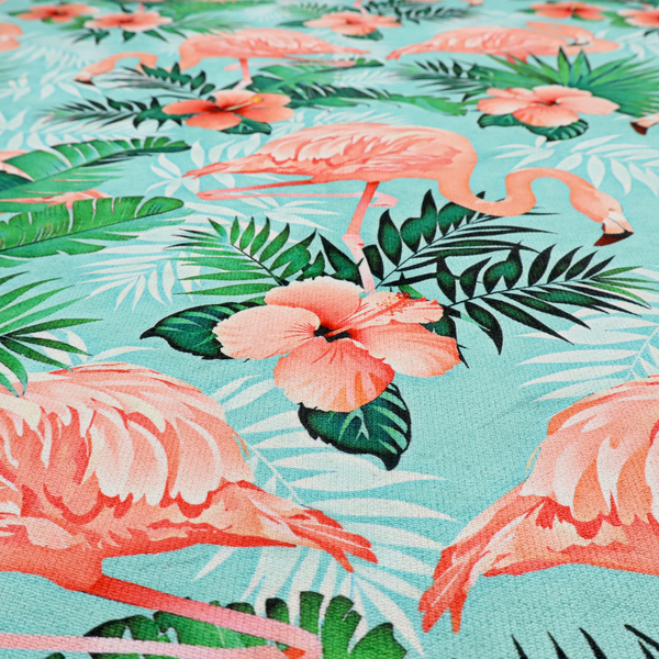 A vibrant tropical pattern featuring pink flamingos, orange hibiscus flowers, and lush green palm leaves on a bright turquoise background.