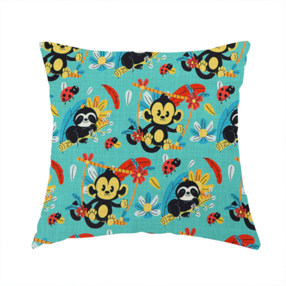 The fabric used to create this handmade cushion is a playful and vibrant children’s fabric featuring a repeat pattern of cute, cartoon-style jungle animals. The design showcases smiling black-and-yellow monkeys swinging on vines, sleepy sloths resting on branches, and tiny red ladybirds scattered throughout. Complemented by tropical flowers and feathers in red and yellow, all set against a bright, textured turquoise-blue background.