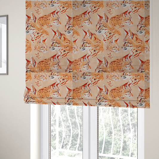 The fabric used to create these Roman blinds is a repeating pattern of illustrated wild cat heads, such as lynxes or bobcats, in shades of orange and cream on a light peach-coloured fabric with a subtle linen-like texture.