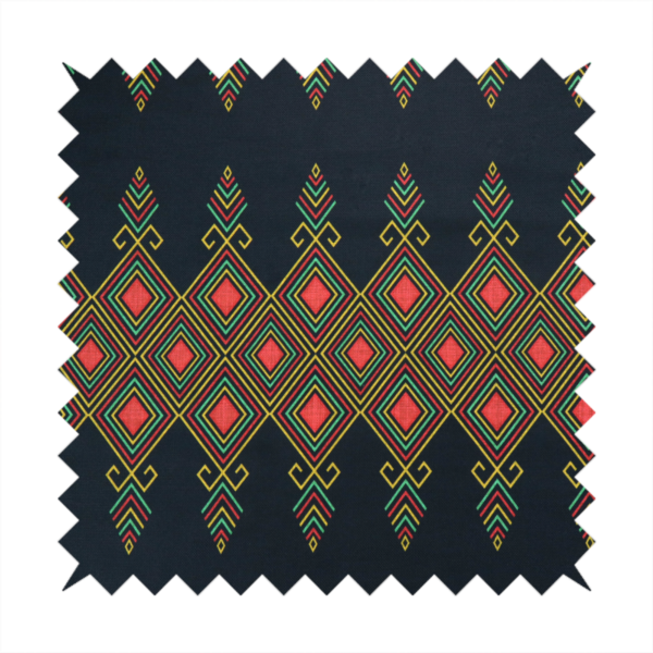 A geometric tribal pattern featuring red, yellow, and green diamonds and linear motifs on a dark charcoal-black fabric background.
