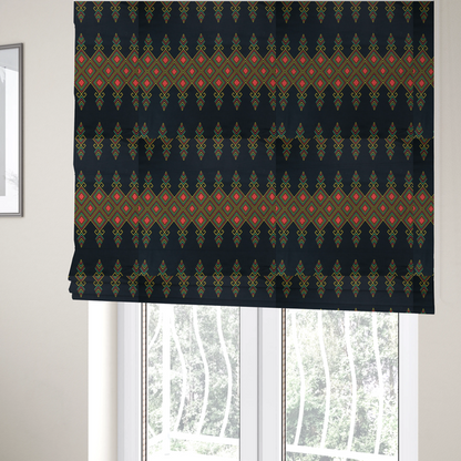 The fabric used to create these Roman blinds is a geometric tribal pattern featuring red, yellow, and green diamonds and linear motifs on a dark charcoal-black fabric background.