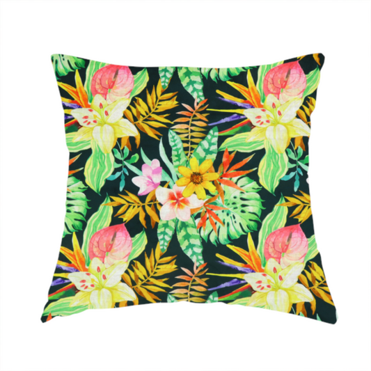 The fabric used to create this handmade cushion is a vivid tropical botanical pattern featuring lilies, birds of paradise, and pink plumeria blossoms set against lush green leaves on a deep midnight black background.