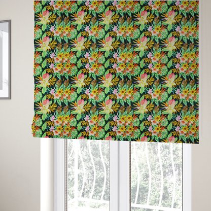 The fabric used to create these Roman blinds is a vivid tropical botanical pattern featuring lilies, birds of paradise, and pink plumeria blossoms set against lush green leaves on a deep midnight black background.